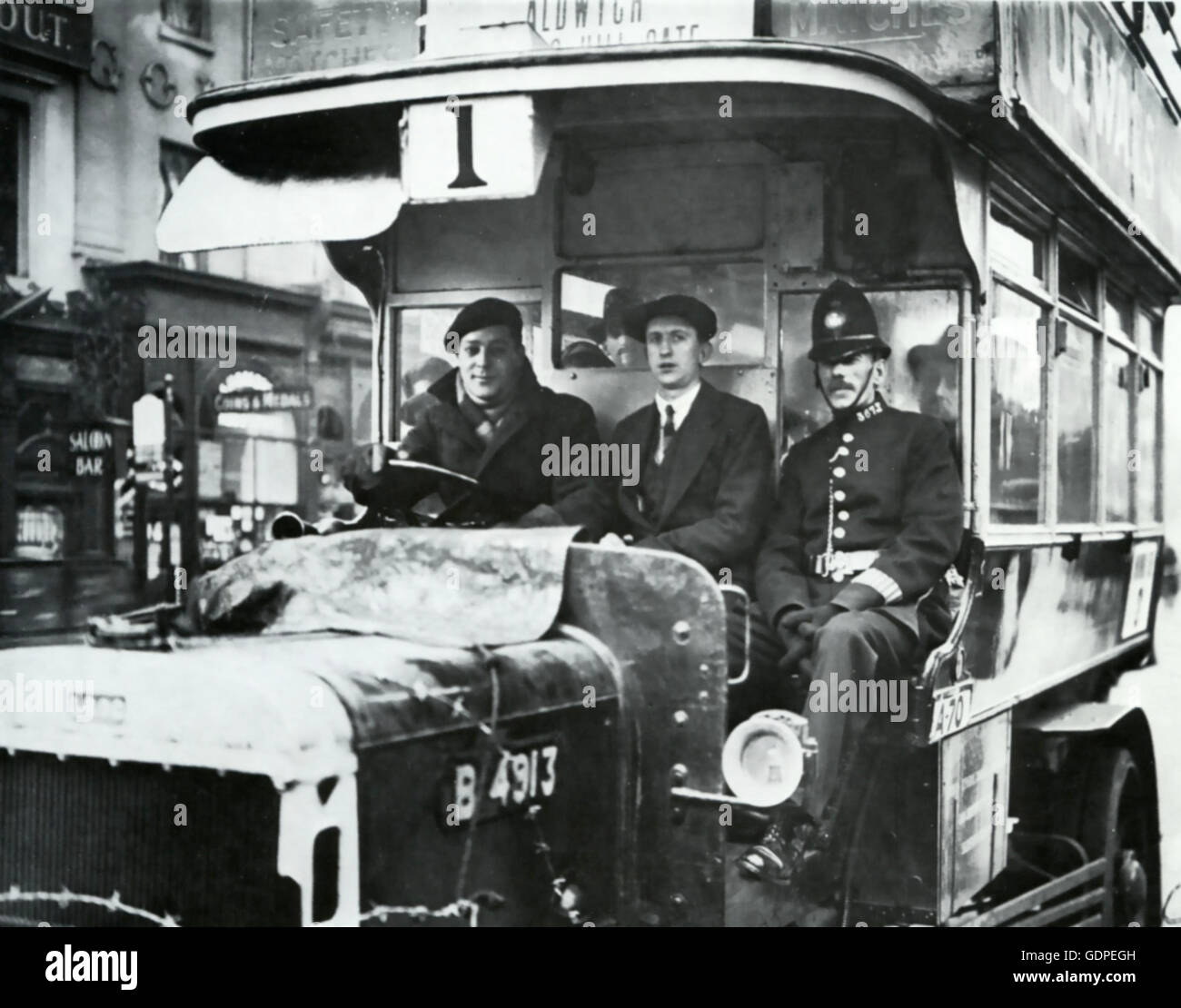 GENERAL STRIKE 1926 A policeman acts as guard for two bus drivers who defied the strike as they make their way along Oxford Street, London. Photo: GLC Archive Stock Photo