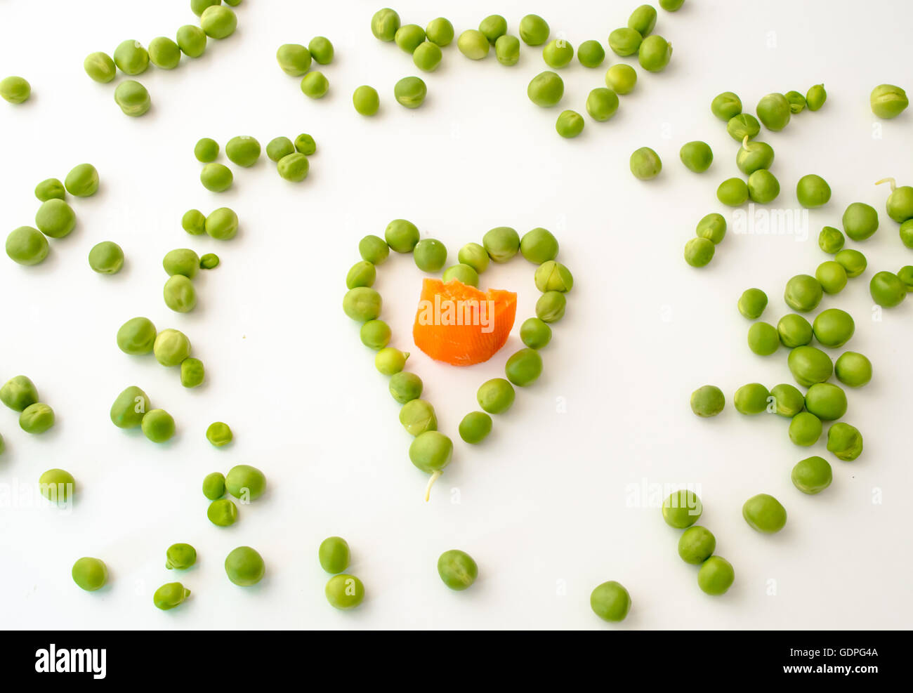Heart Figure Made With Peas on White Background Stock Photo