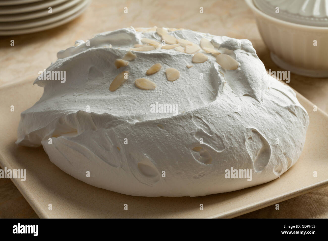 Fresh baked meringue with almonds Stock Photo
