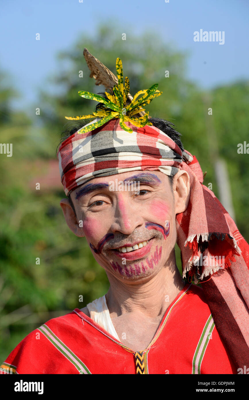 a Clown in traditional dresses at a shinpyu ceremony in a village neat ...
