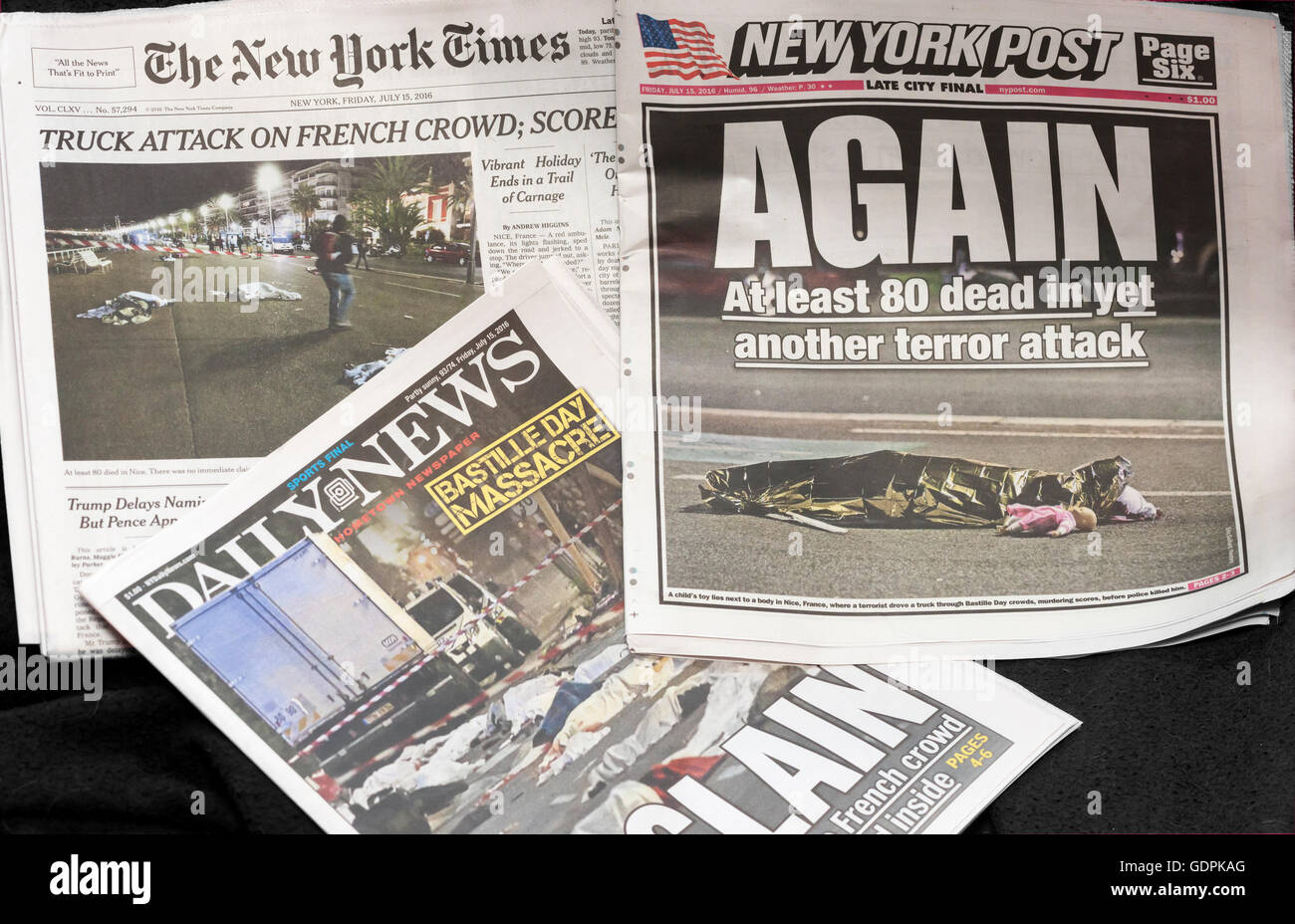 Headlines of New York newspapers on Friday, July 15, 2016, 2016, report on the previous day's Bastille Day mass murder in Nice, France.. (© Richard B. Levine) Stock Photo