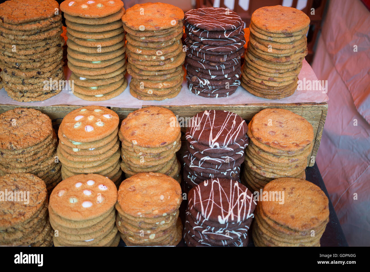 PIles of cookies on sale at a market stall Stock Photo