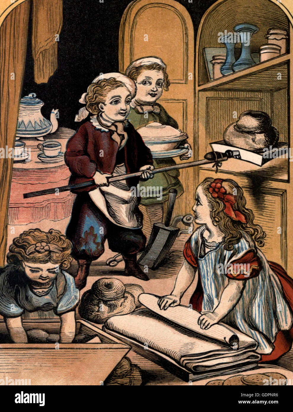 The Little Bakers - Victorian era children playing at baking Stock Photo