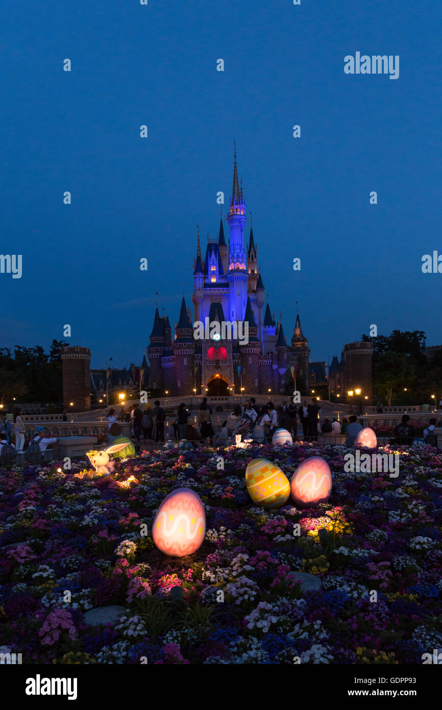 Cinderella's castle with Easter decoration illuminated at night at the Tokyo Disney Resort in Japan Stock Photo