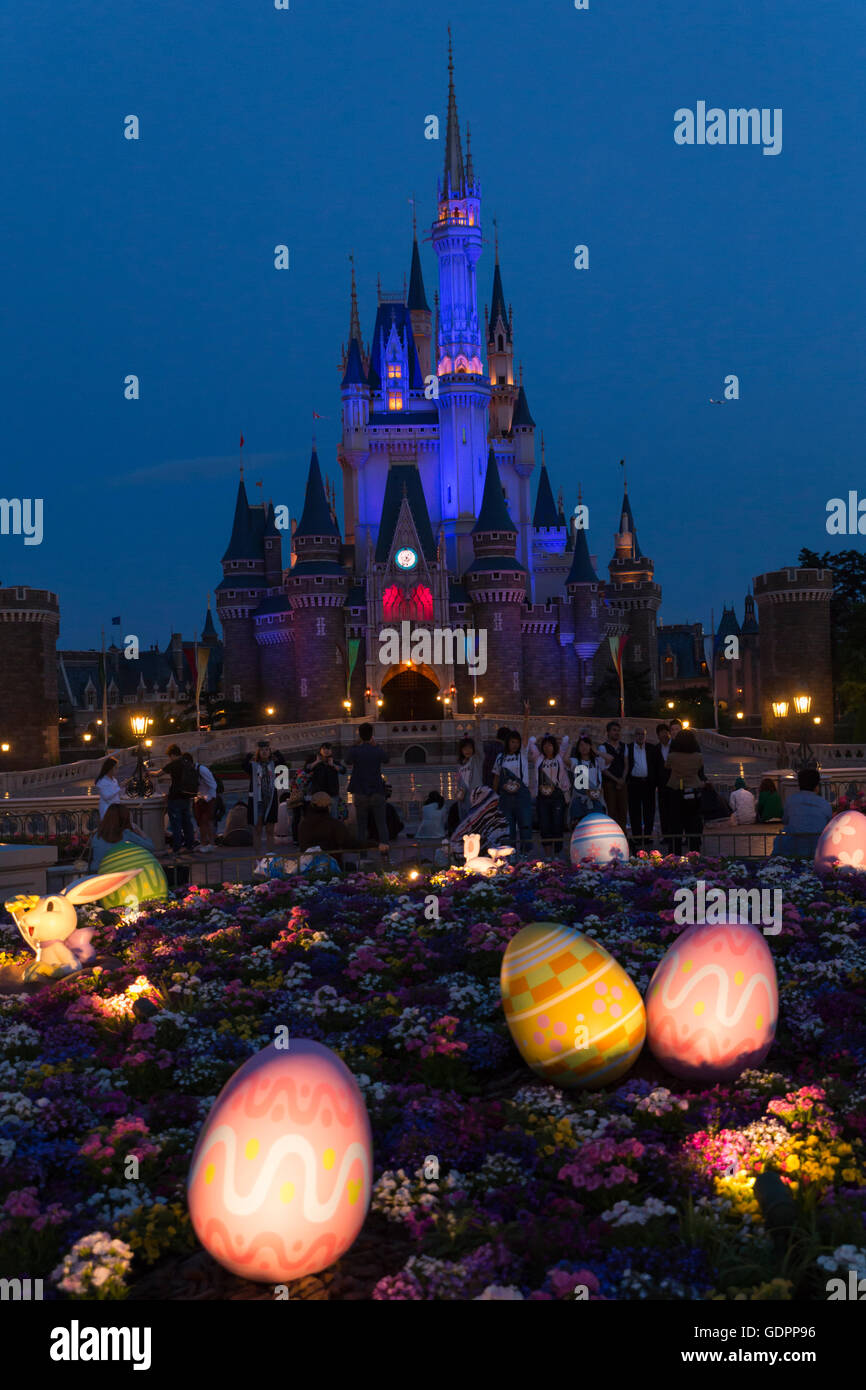 Cinderella's castle with Easter decoration illuminated at night at the Tokyo Disney Resort in Japan Stock Photo