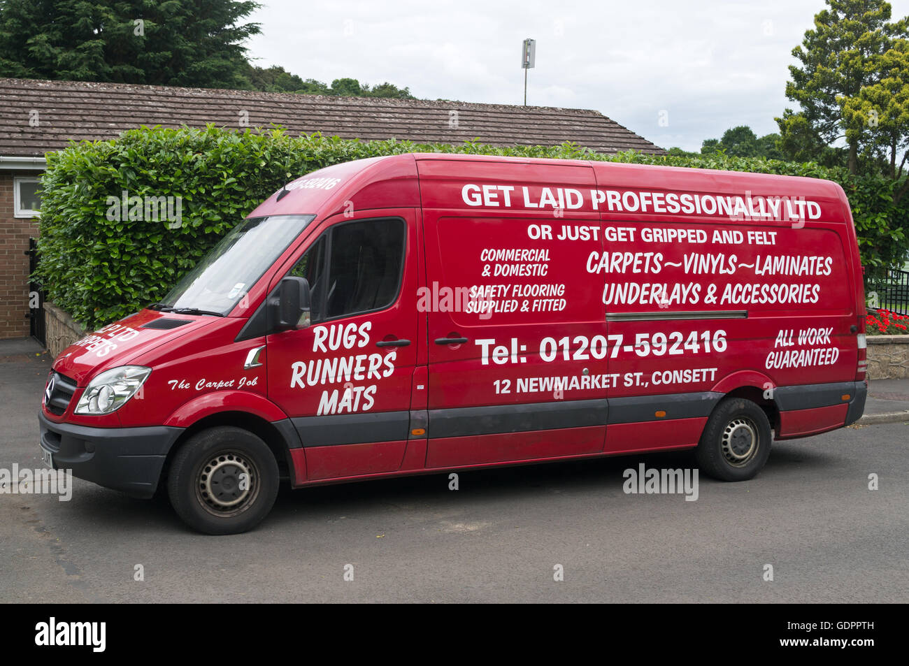 Tradesman's van with humorous signage, Get Laid Professionally, or Just Get Gripped and Felt Stock Photo