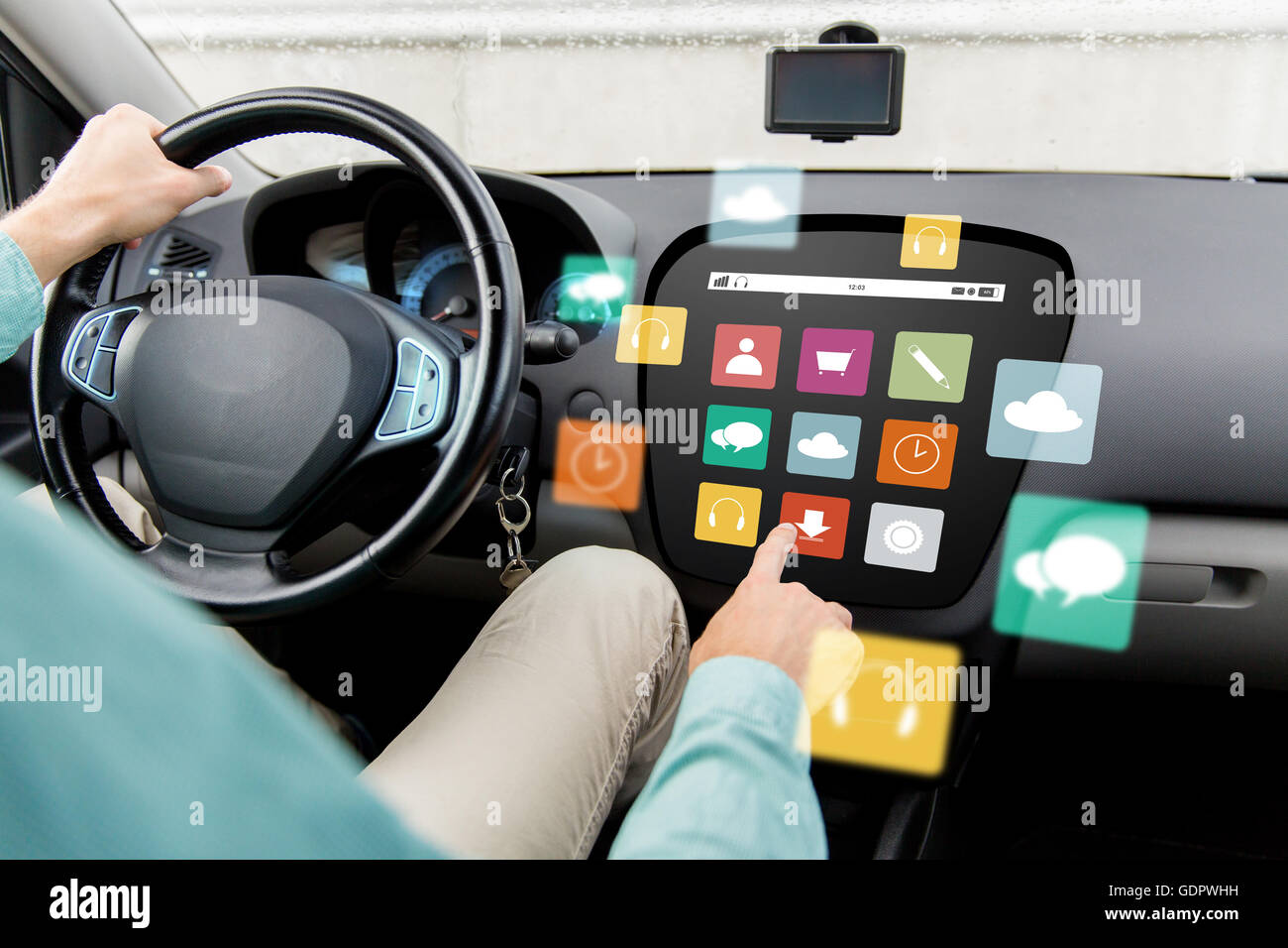 man driving car with menu icons on board computer Stock Photo Alamy