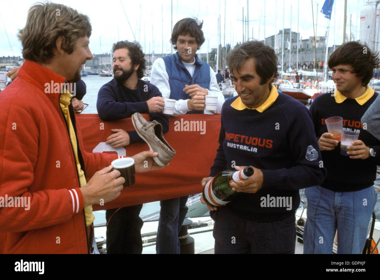 AJAX NEWS PHOTOS. AUGUST, 1979. PLYMOUTH, ENGLAND. - FASTNET 79 - ADMIRAL'S CUP - WINNERS - AUSTRALIAN TEAM MEMBERS CELEBRATE THEIR VICTORY DURING AN IMPROMPTU CHAMPAGNE PARTY AFTER POINTS SCORE WAS ANNOUNCED IN PLYMOUTH. PHOTO:JONATHAN EASTLAND/AJAX.  REF: 215014/81 Stock Photo