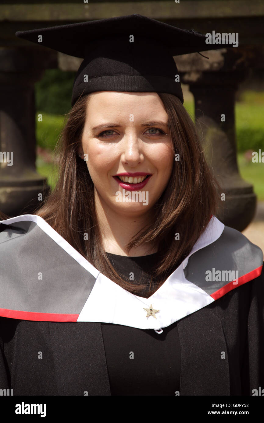Closeup of a pretty young women in cap and gown on her graduation day Stock Photo