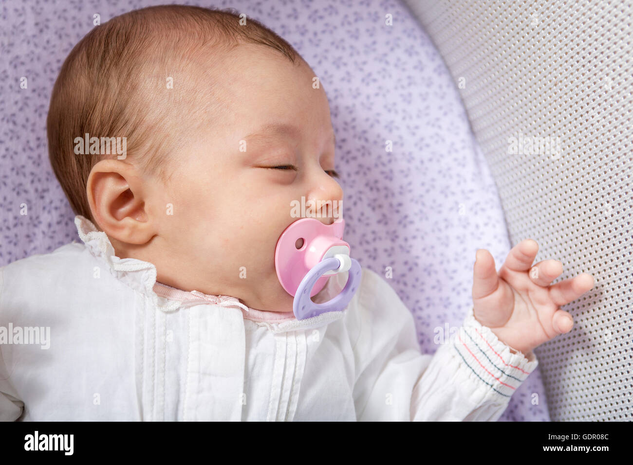 Baby sleep in a small cradle Stock Photo Alamy