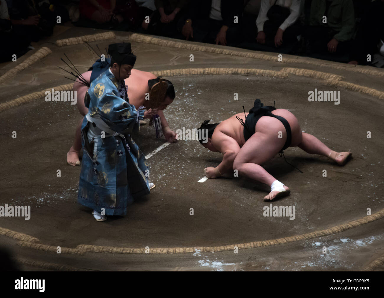 Two sumo wrestlers fighting at the ryogoku kokugikan arena, Kanto region, Tokyo, Japan Stock Photo