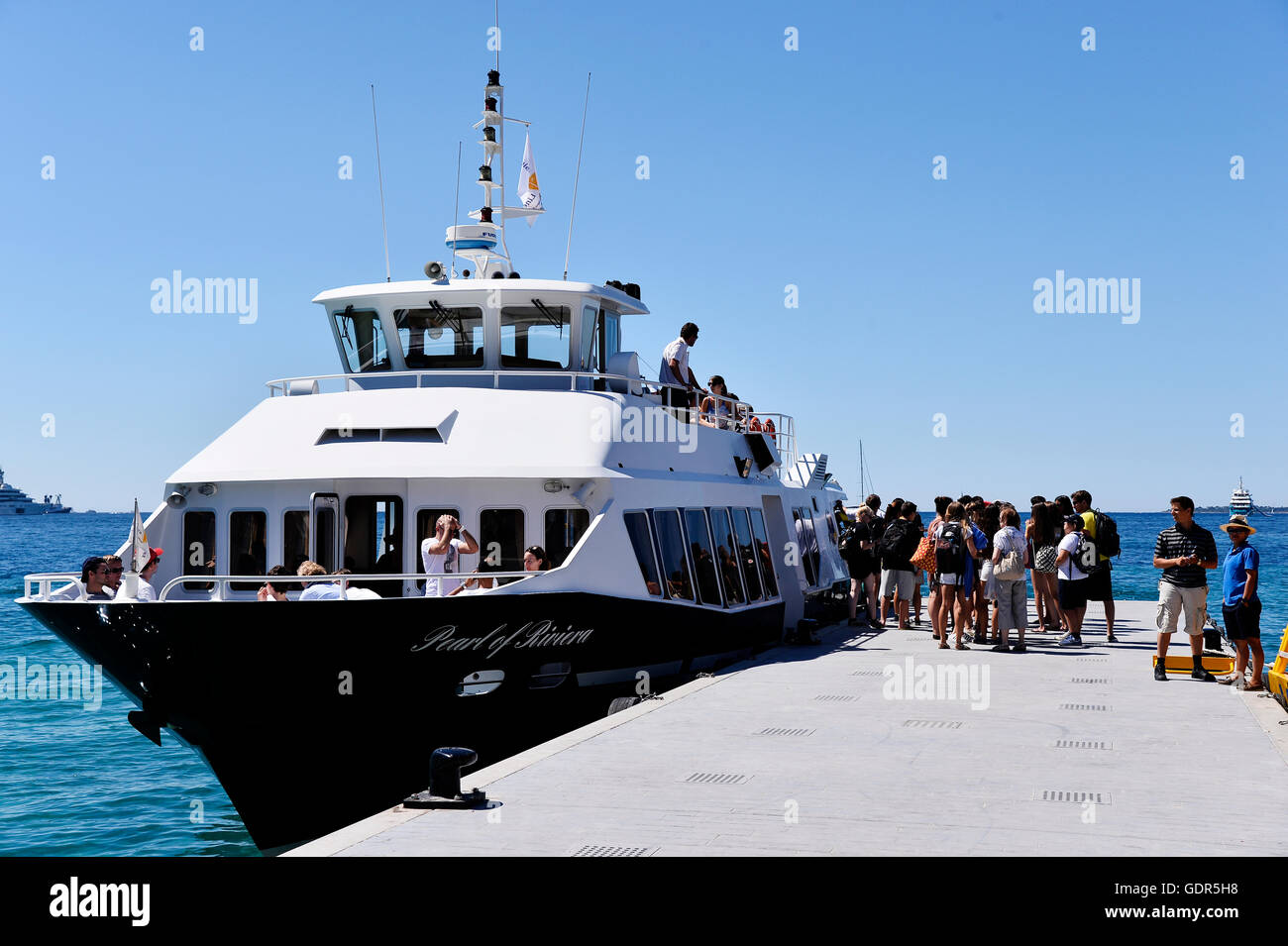 tourists harbour in juan les pins, french riviera, france Stock Photo