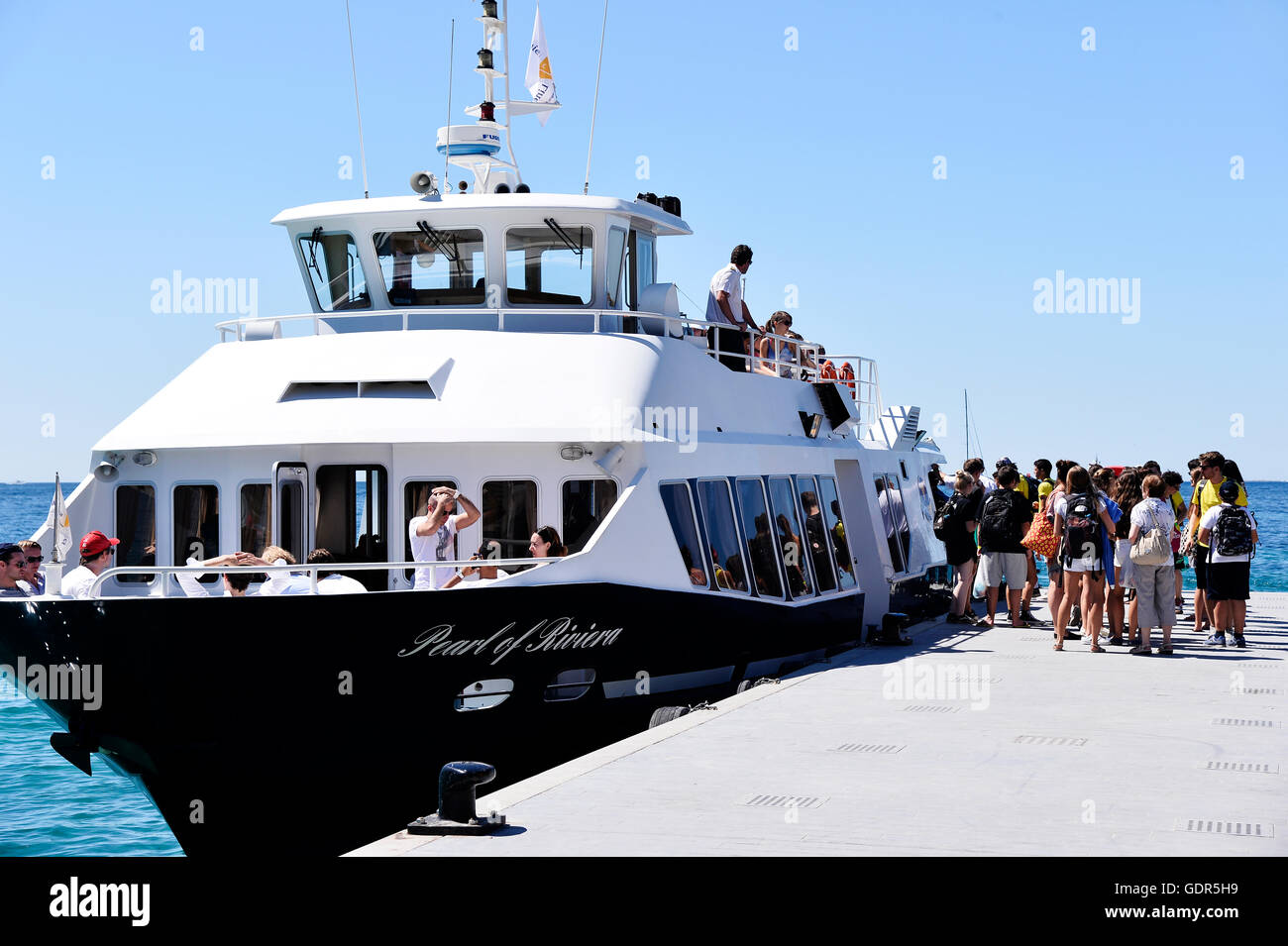 tourists harbour in juan les pins, french riviera, france tourism, harbour, harbor Stock Photo