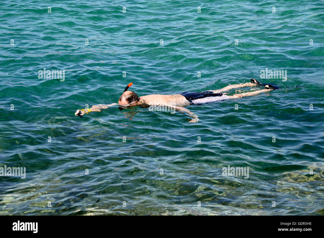 Man snorkelling in mediterranean sea Stock Photo