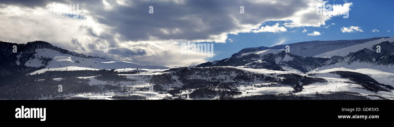 Panorama of winter mountains at evening. Greater Caucasus, Shahdagh. Qusar rayon of Azerbaijan. Stock Photo