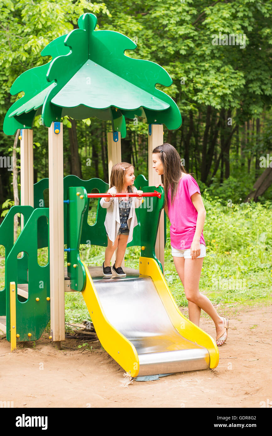 Happy family playing together at outdoor park Stock Photo - Alamy