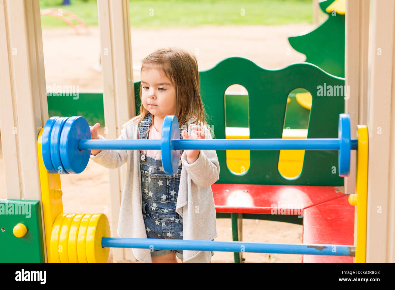 little girl on the summer playground Stock Photo - Alamy