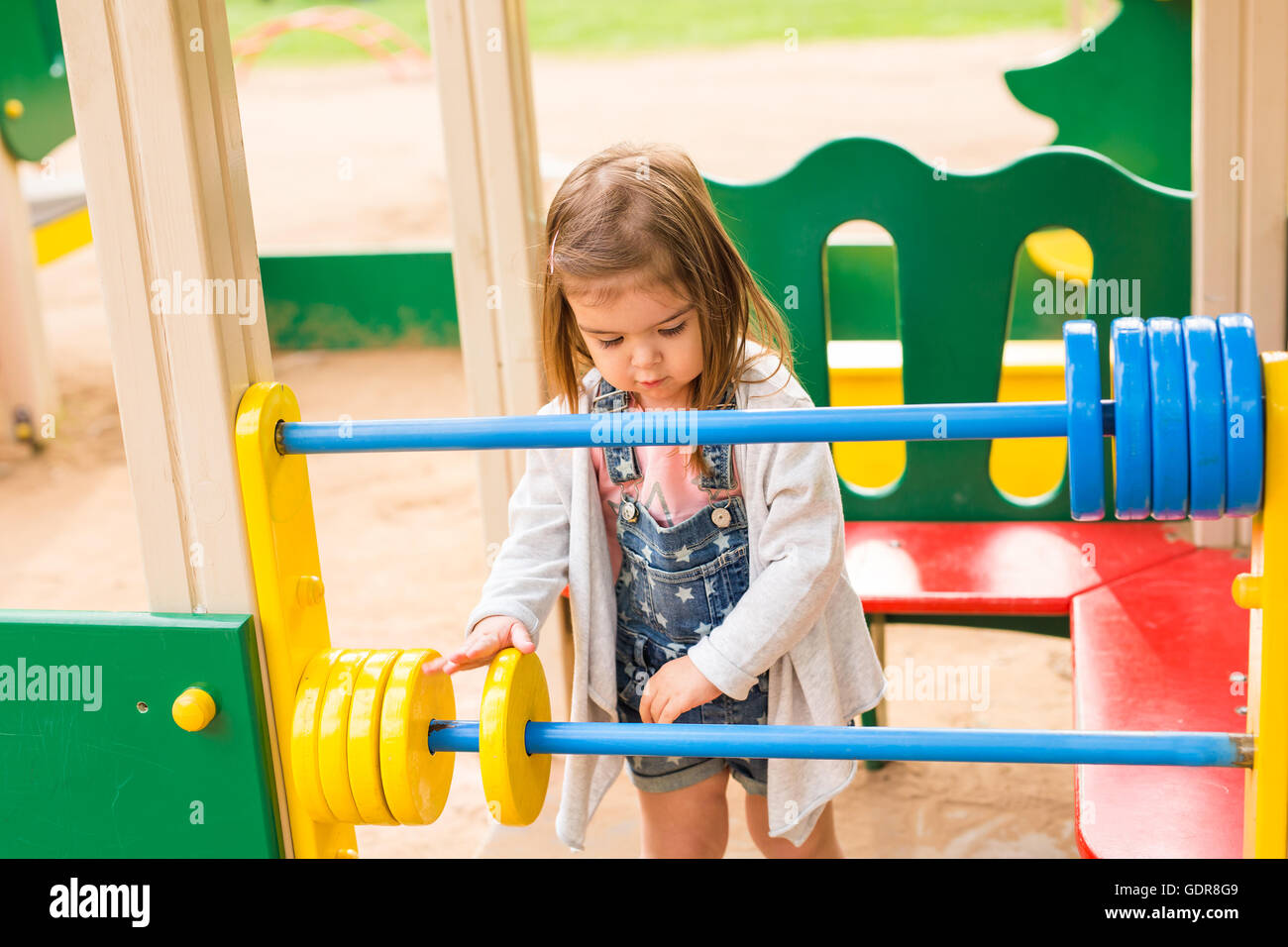 little girl on the summer playground Stock Photo - Alamy