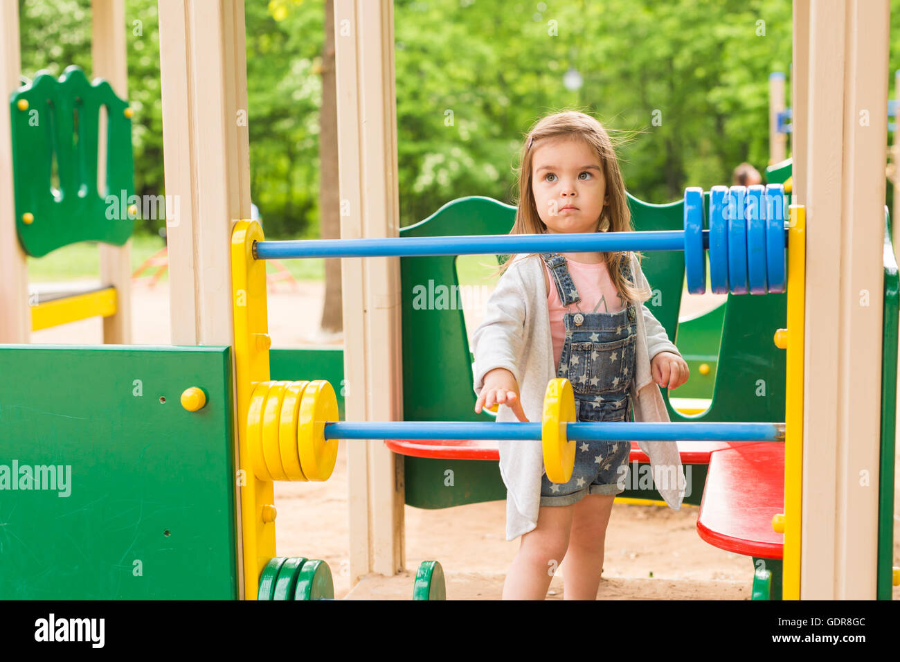 little girl on the summer playground Stock Photo - Alamy