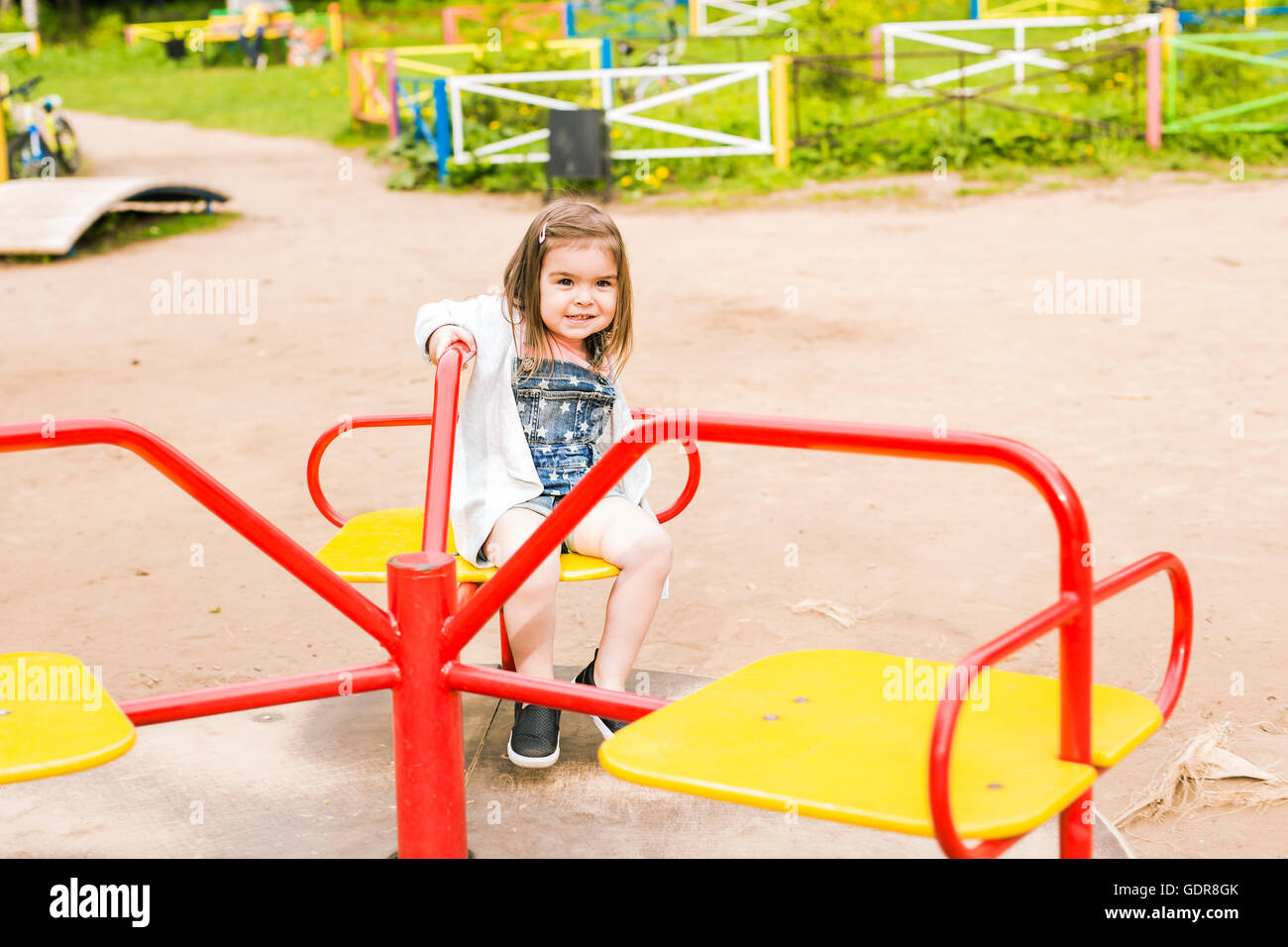 little girl on the summer playground Stock Photo - Alamy