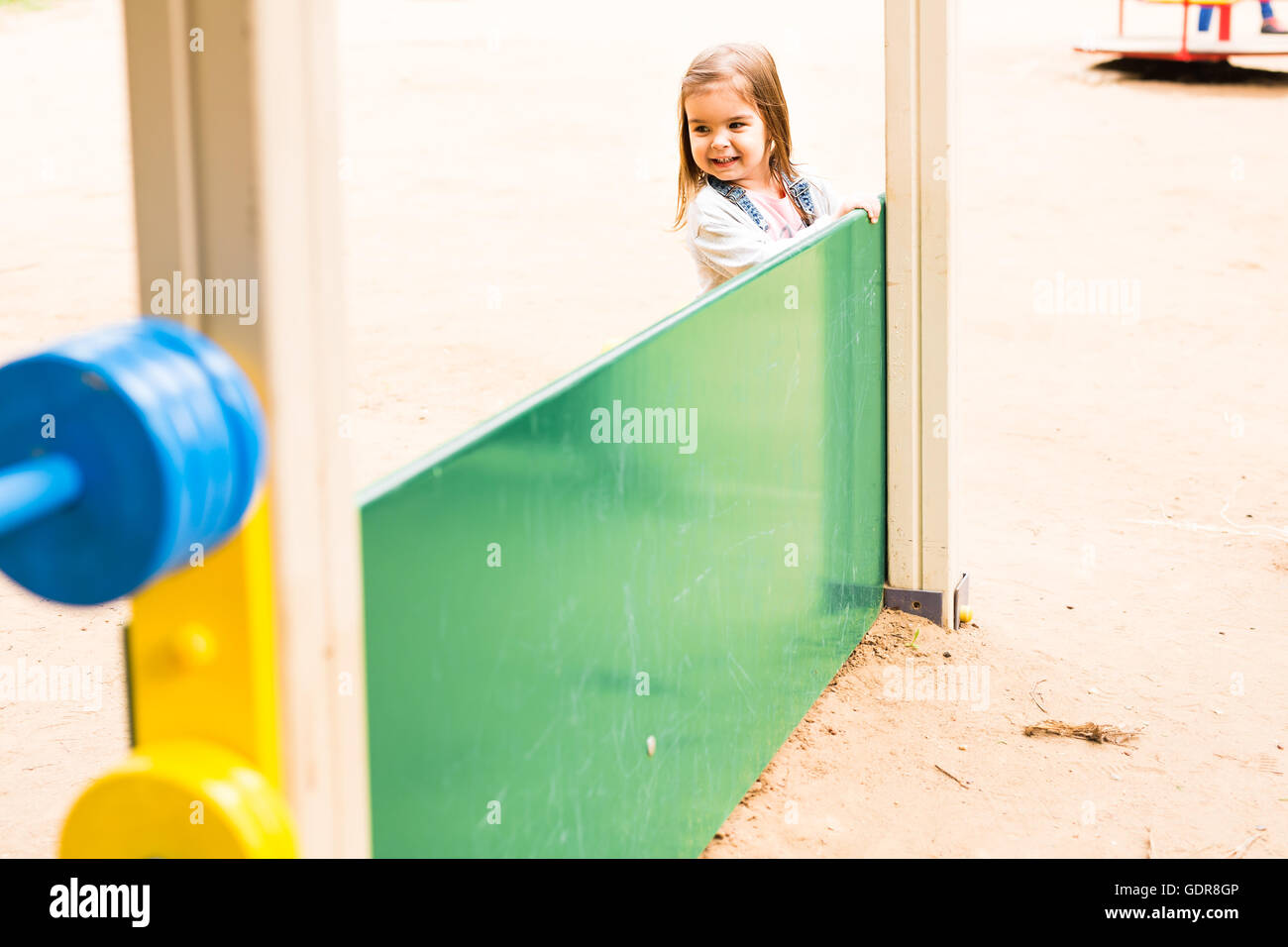 little girl on the summer playground Stock Photo - Alamy