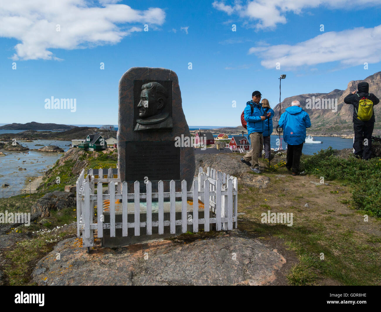 Cruise ship tourists visiting Statue missionary Gustav Olsen outside the new Church built 1926 , Sisimiut (Holsteinsborg), West Greenland Europe Stock Photo