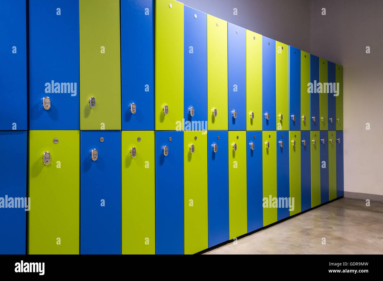 Green and blue clothes locker room in a gym or sports center Stock Photo