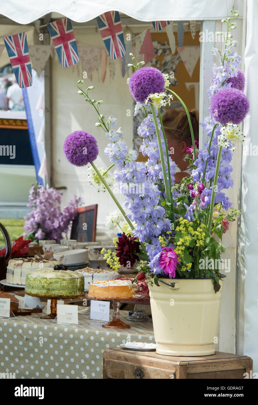 Cut Flower display on English tea stall at the Thames Traditional Boat Festival, Henley On Thames, Oxfordshire, England Stock Photo