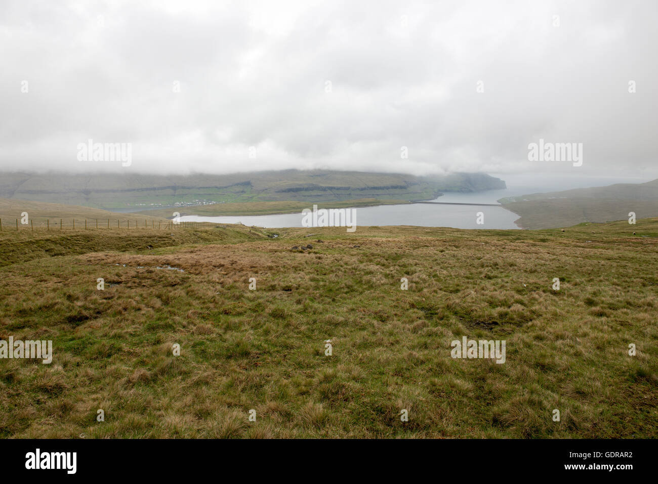 Eidi on the Faroe Islands with landscape, lake and clouds Stock Photo -  Alamy