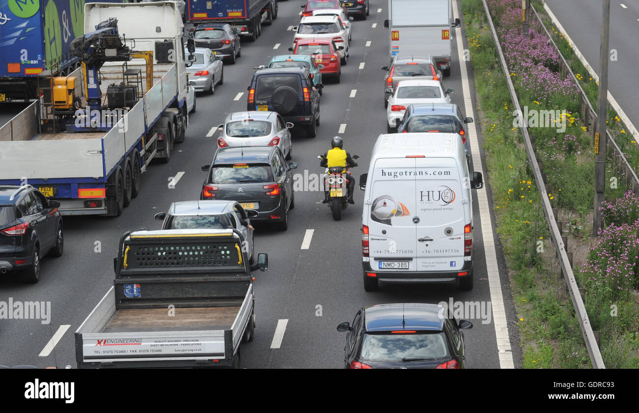 TRAFFIC QUEUES AND  FILTERING MOTORCYCLIST ON THE NORTHBOUND M6 MOTORWAY NEAR STAFFORD RE SMART MOTORWAYS CONGESTION ROAD UK Stock Photo