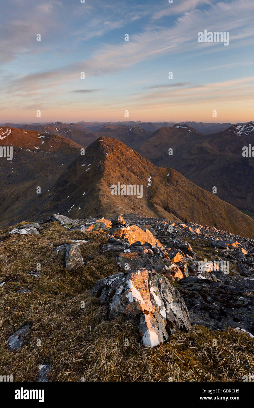 Sgurr na Carnach and Sgurr na Ciste Duibhe beyond in the last light of the day Stock Photo