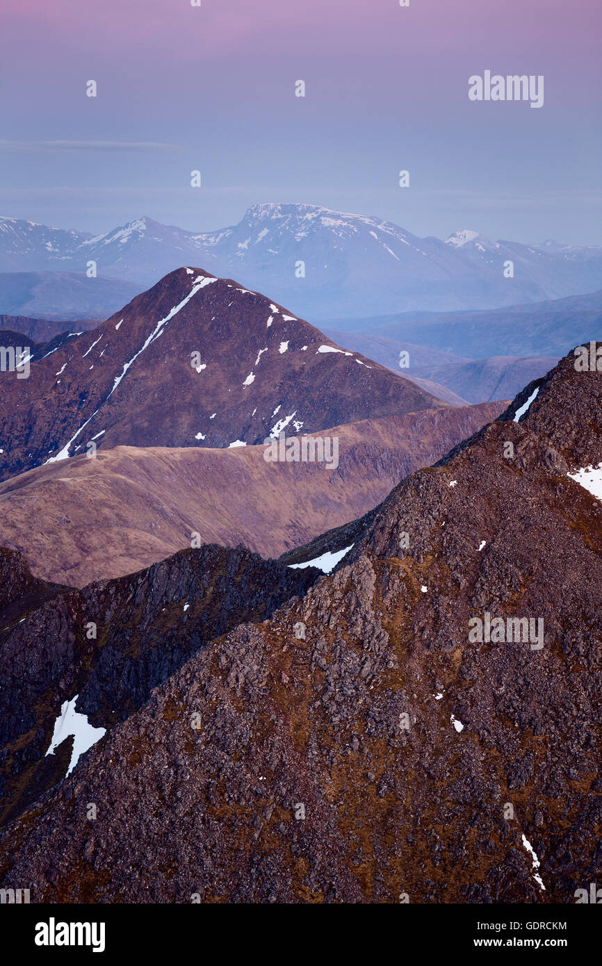 The shapely summit of Sgurr an Lochain during the blue hour, seen from the five Sisters of Kintail Stock Photo