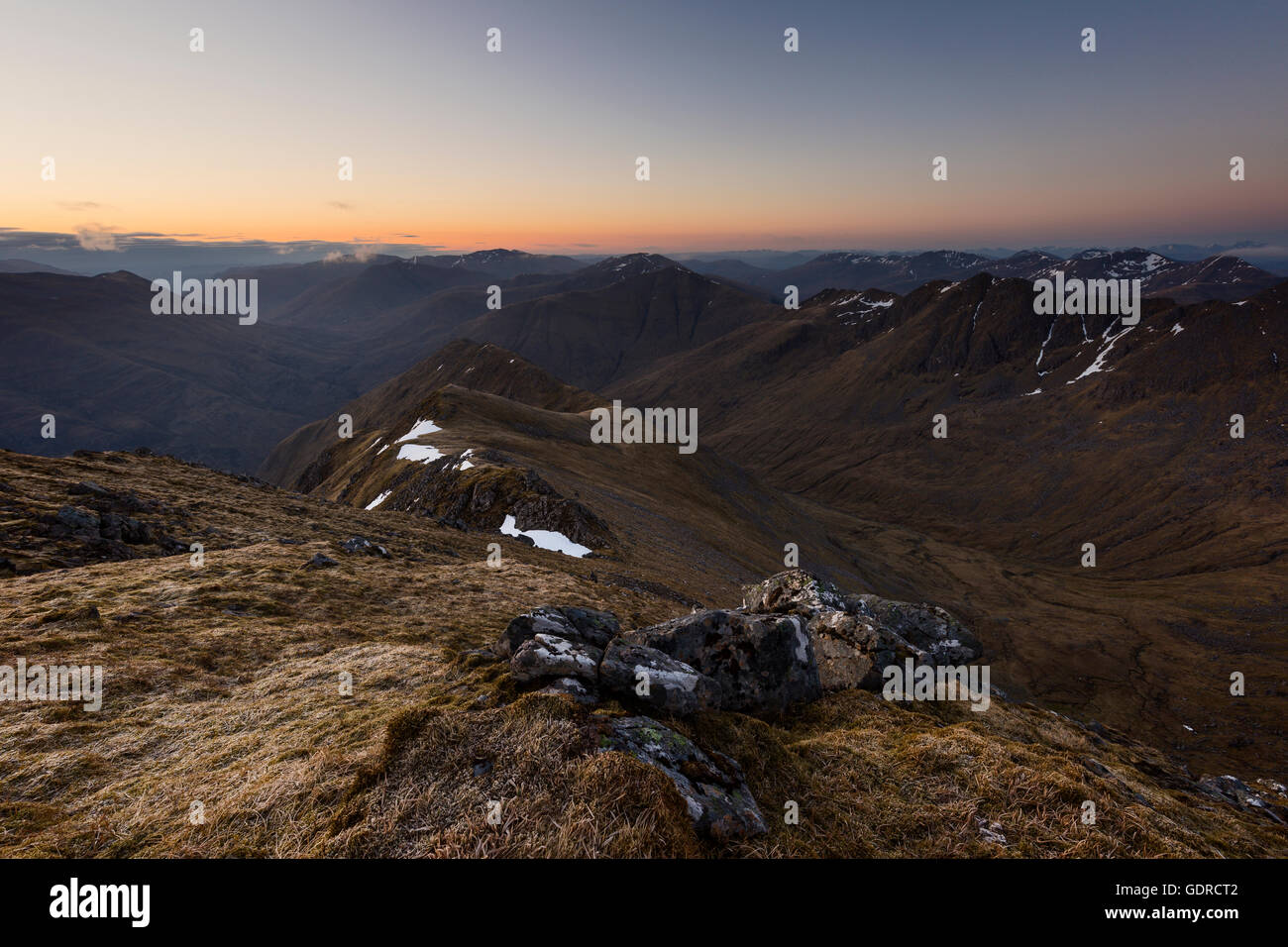 Looking out over Gleann Lichd and the hills of Kintail at dusk Stock Photo