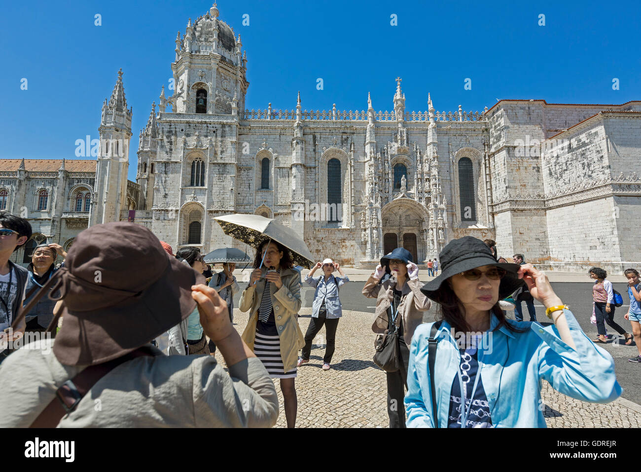 Japanese tourists organized before the Jerónimos Monastery, UNESCO World Heritage Site, Lisbon, District of Lisbon, Portugal, Stock Photo