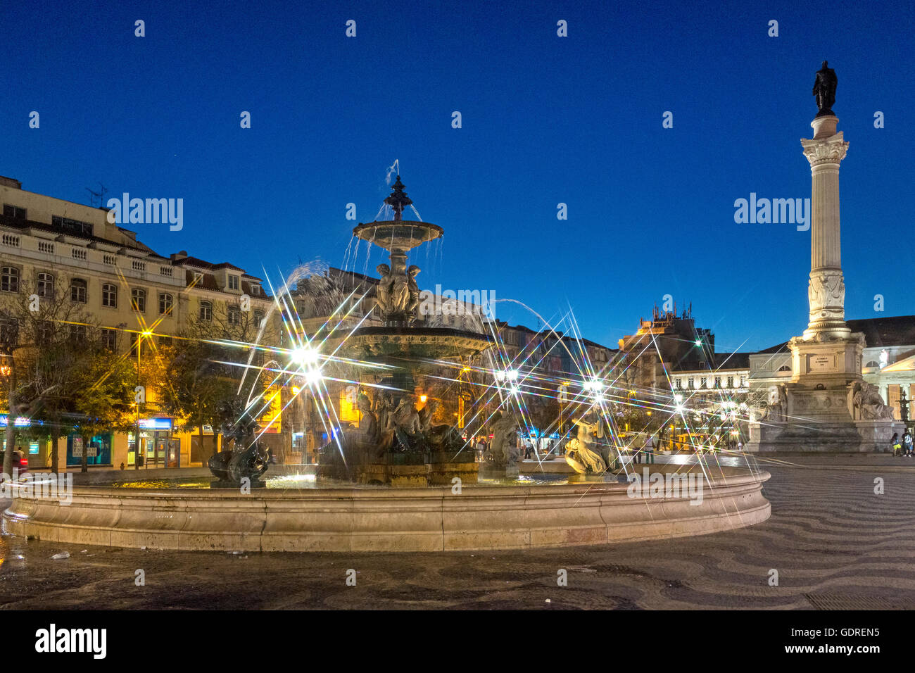 Fountain, Monument, Rossio Square, paving stones in waveform, wave pattern, night scene, blue hour, Lisbon, District of Lisbon, Stock Photo