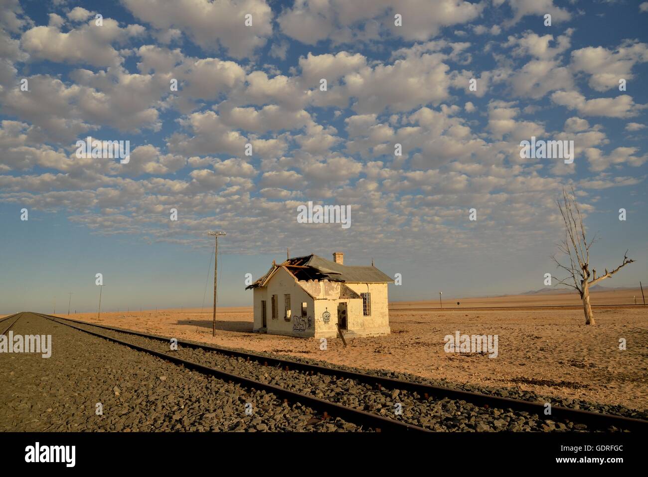 Derelict house by railroad tracks, former German railway station of Garub, Aus, Karas Region, Namibia Stock Photo