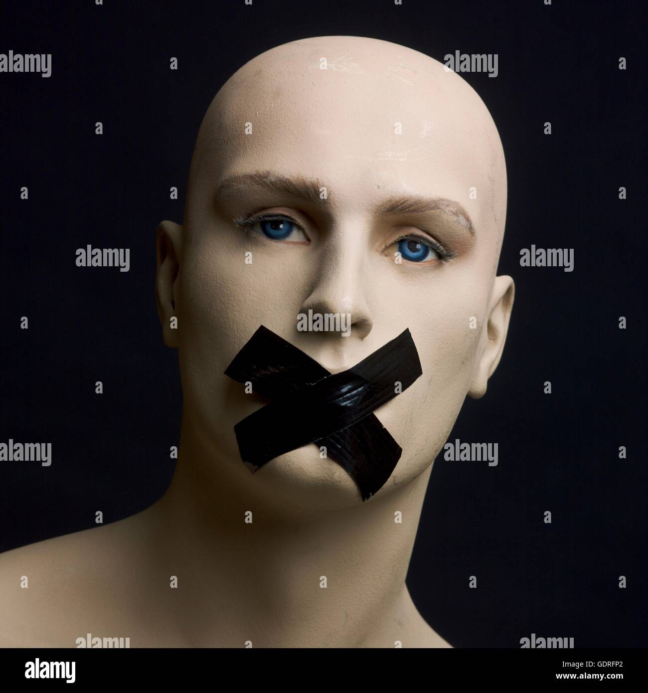 Dummy, mannequin, tape over mouth Stock Photo Alamy