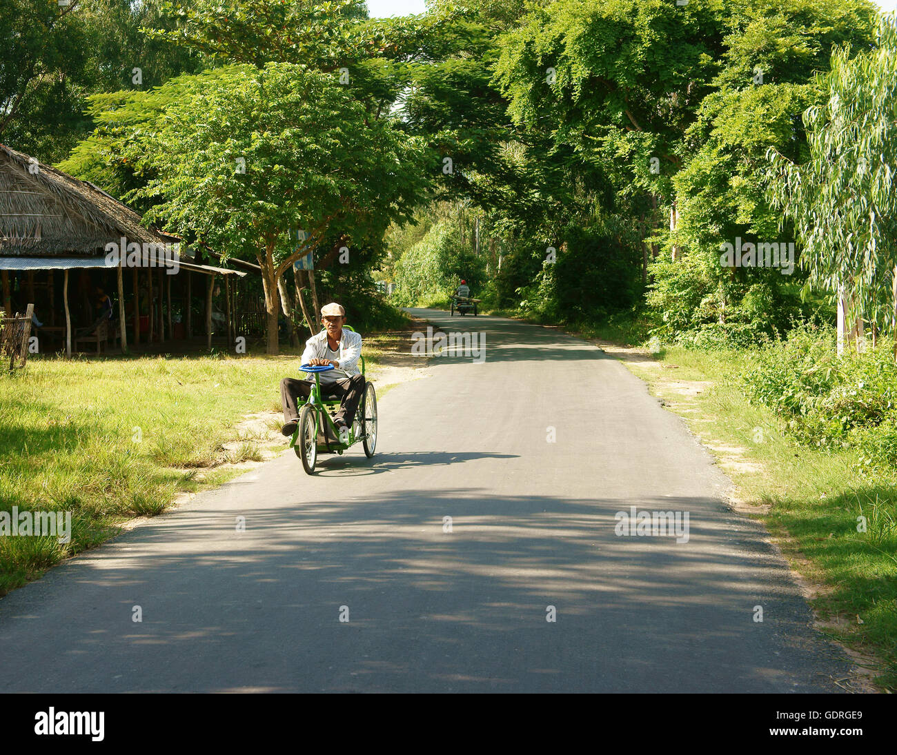 CHAU DOC, VIET NAM SEP 9 Vietnamese people on wheelchair moving on