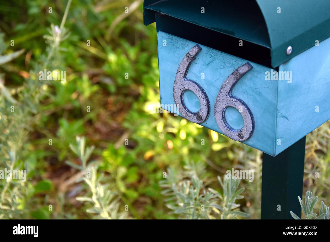Rural letterbox with number 66 Stock Photo - Alamy