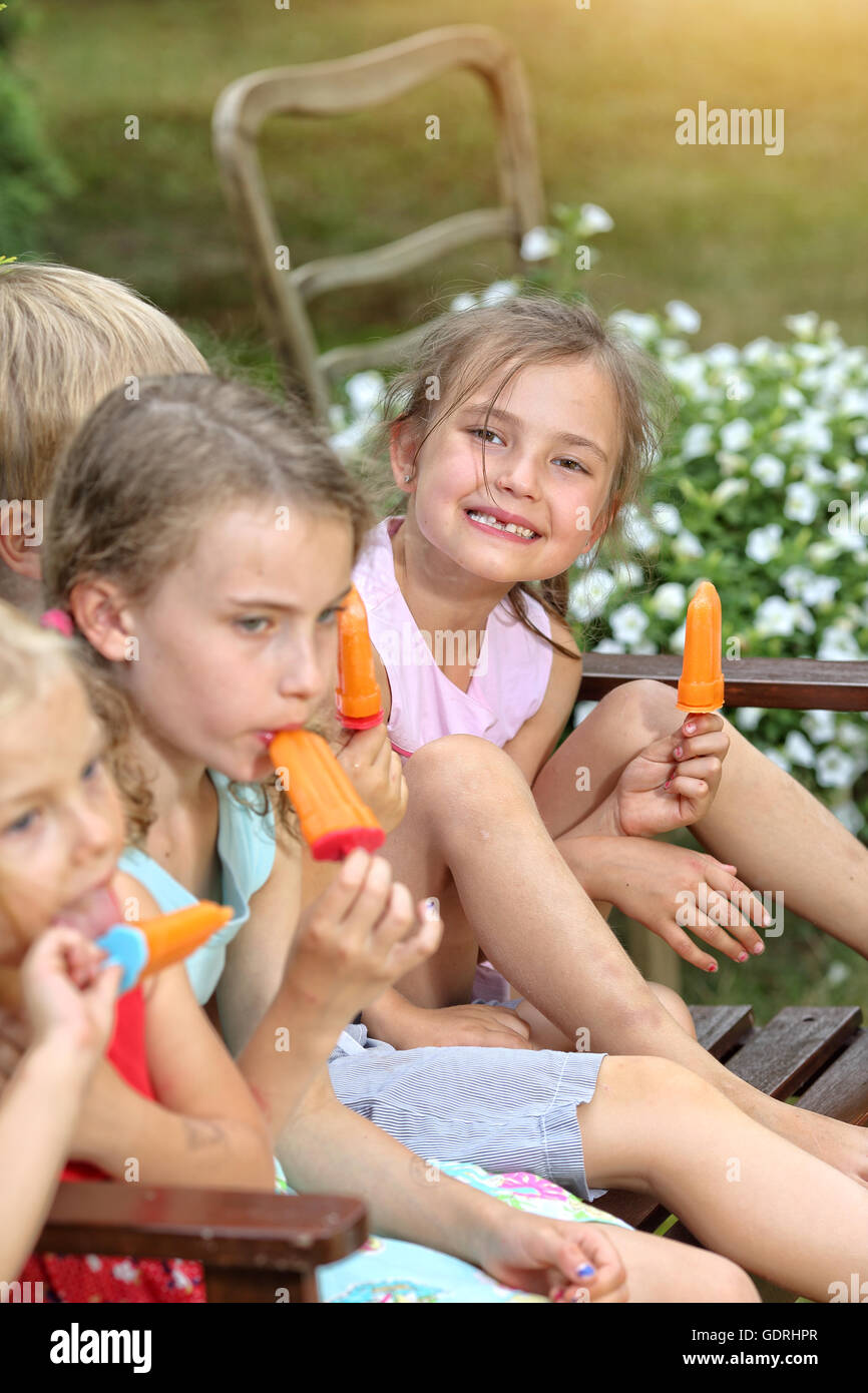 Joyful children eat ice cream Stock Photo Alamy