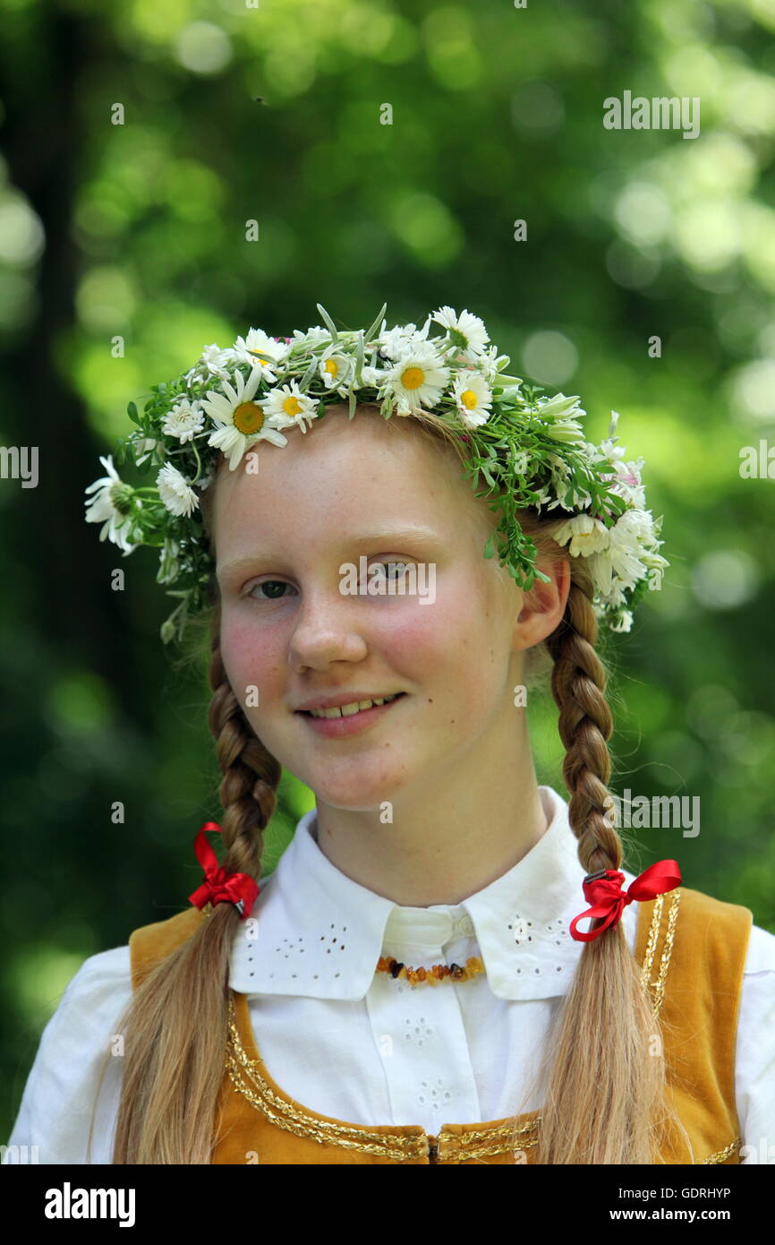 a Women in traditional dress on a Summer Festival in a Parc in the old ...