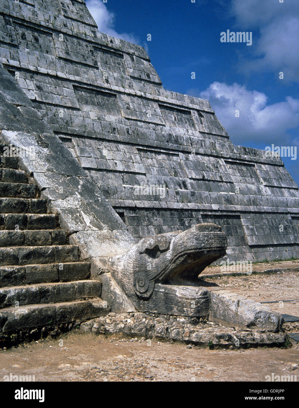 Maya civilization. Classical period, 900-1224. Chichen Itza. A feathered serp sculpture at the base of one of the stairsways of El castillo. Yucatan. Mexico. Stock Photo