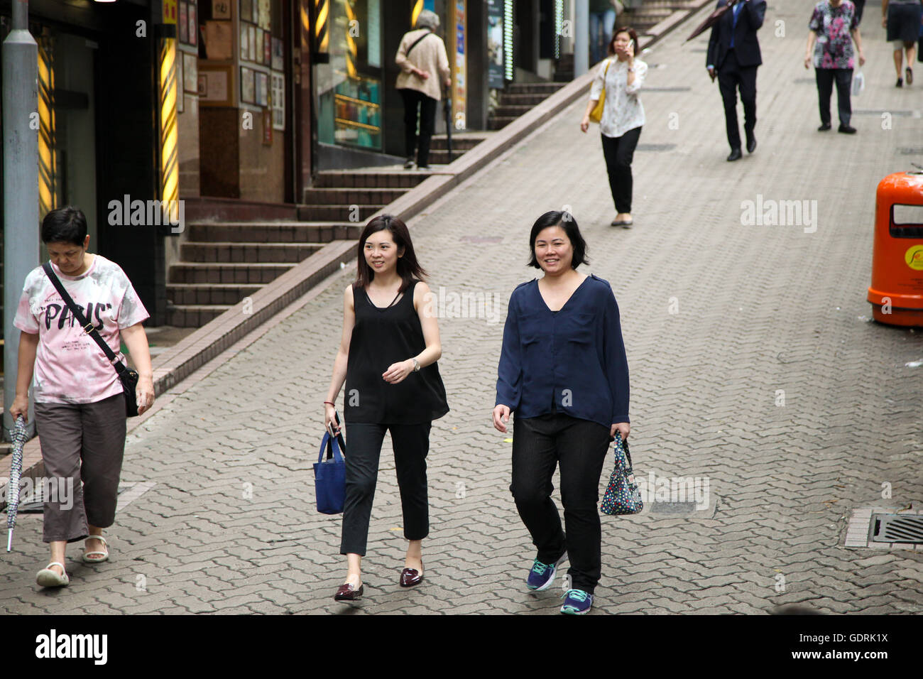 Women walking down a Hong Kong street Stock Photo - Alamy