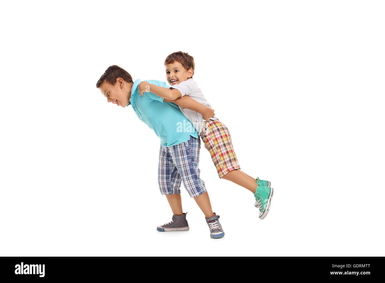 Two children playing with each other isolated on white background Stock Photo