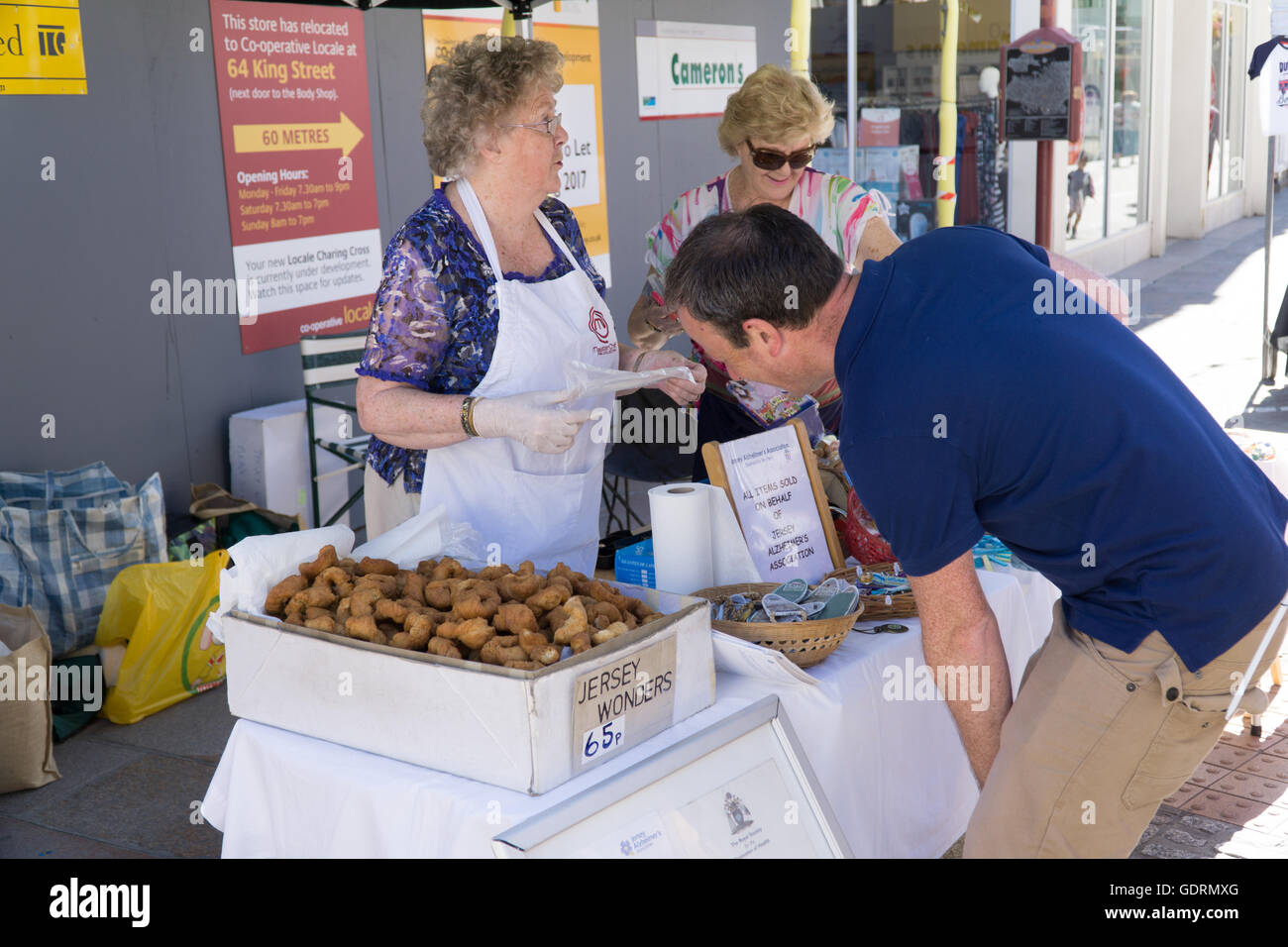 Stall in St.Helier,Jersey, selling a local delicacy called Jersey Wonders Stock Photo