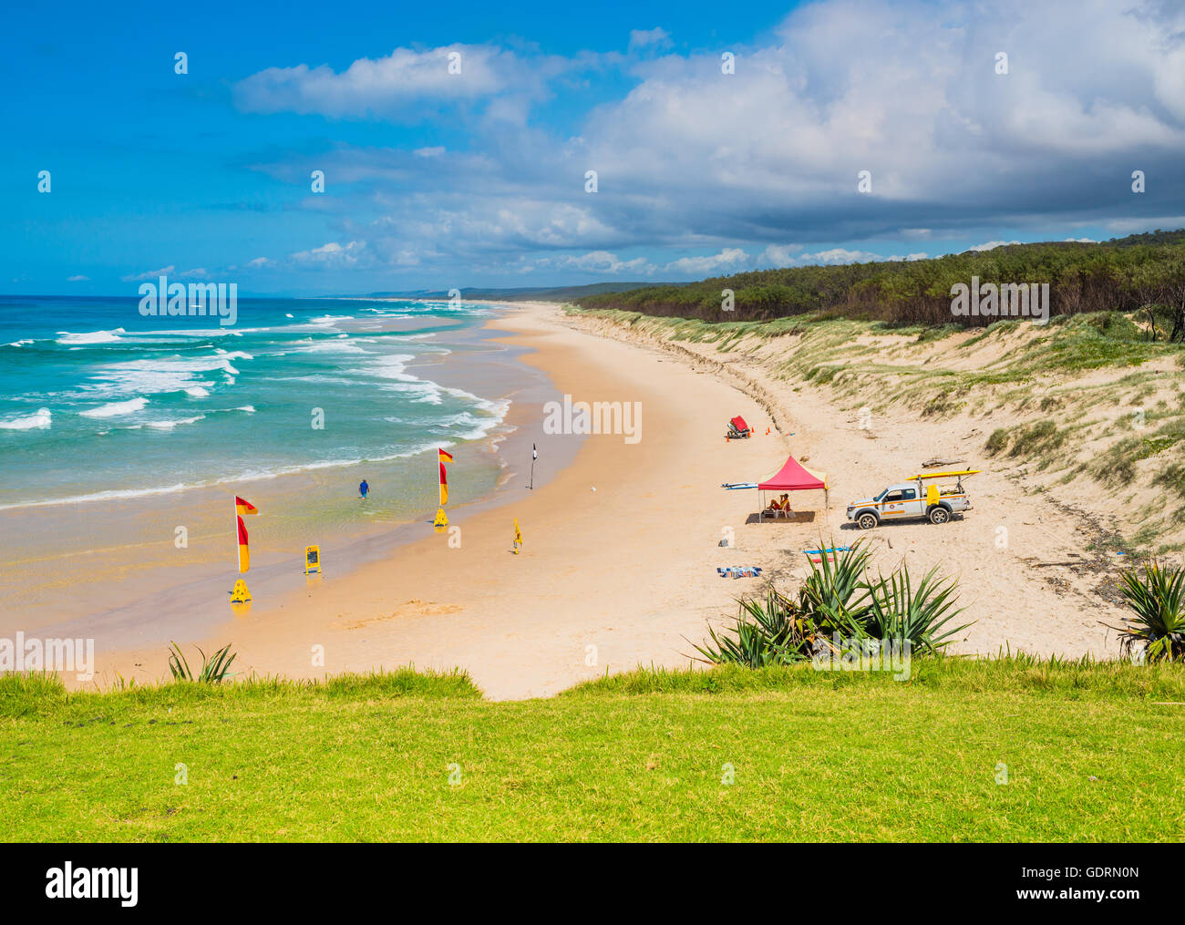 Surf life rescue set up and keeping an eye on people swimming between the flags on a lovely beach at North Stradbroke Island Stock Photo