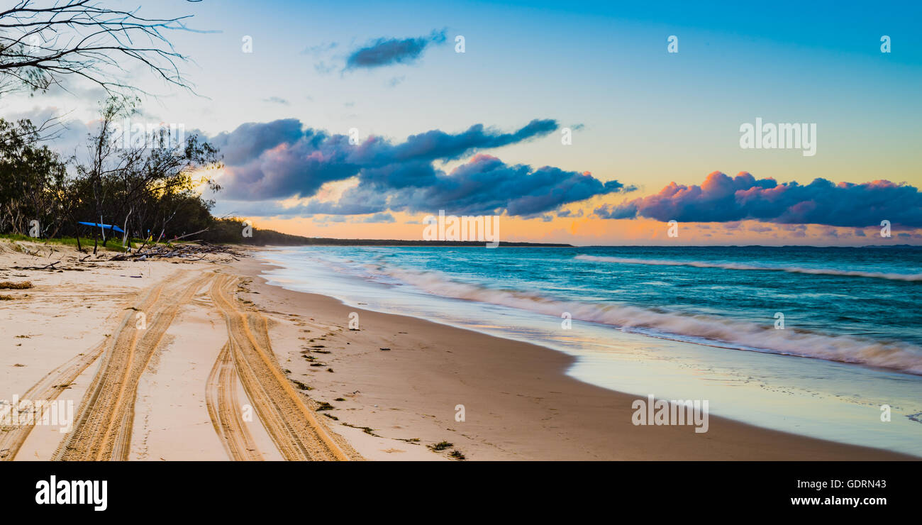 Looking up the beach on North Stradbroke Island as the tide comes in and the sun sets in the