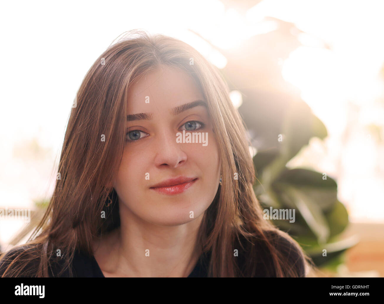 portrait of a pretty young girl in café Stock Photo