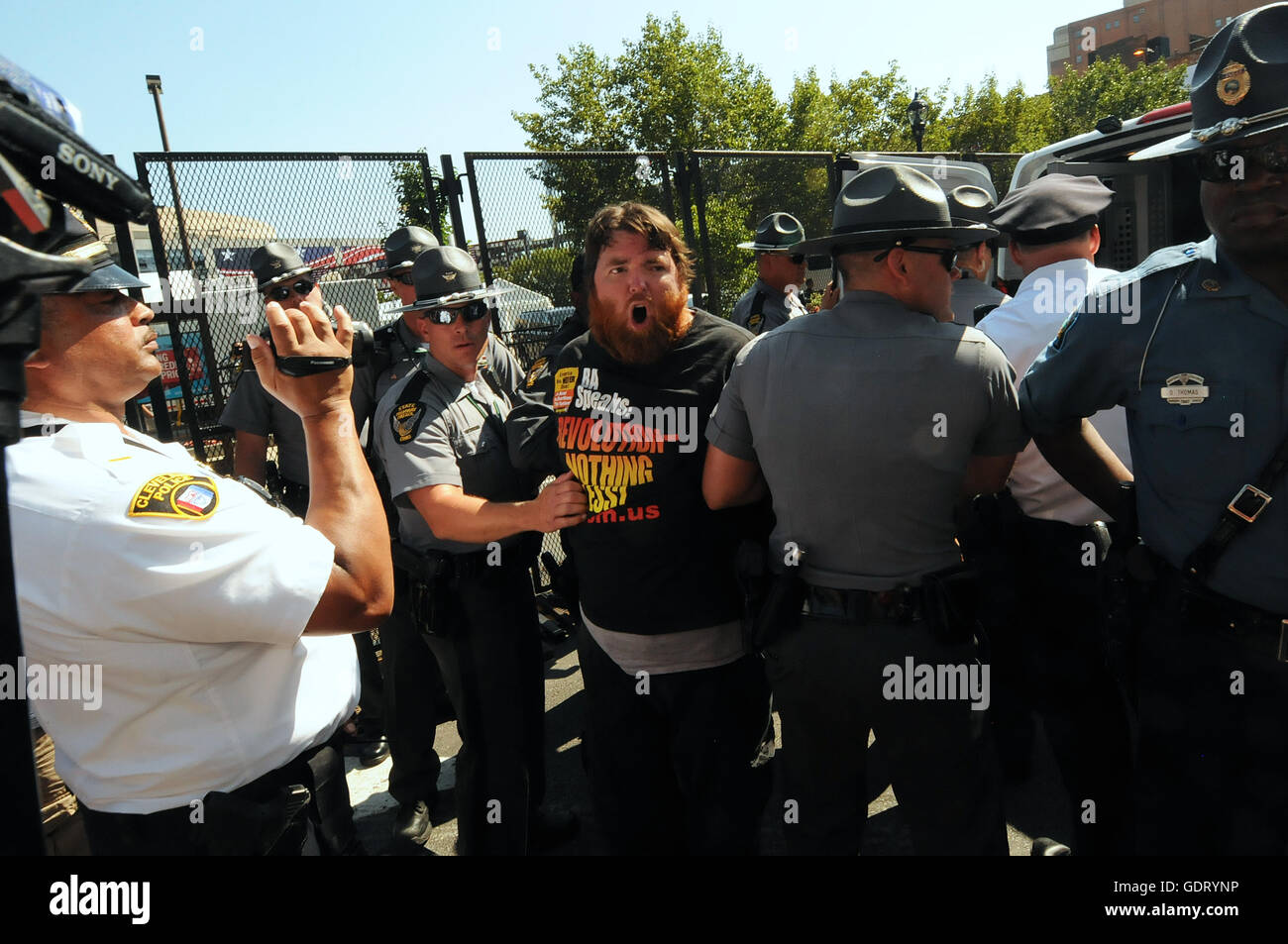 Cleveland, Ohio, USA. 20th July, 2016. A member of the Revolutionary Communist Party is arrested after the group attempted to burn a flag near the Quicken Loans Arena on day three of the 2016 Republican National Convention. Credit:  Paul Hennessy/Alamy Live News Stock Photo