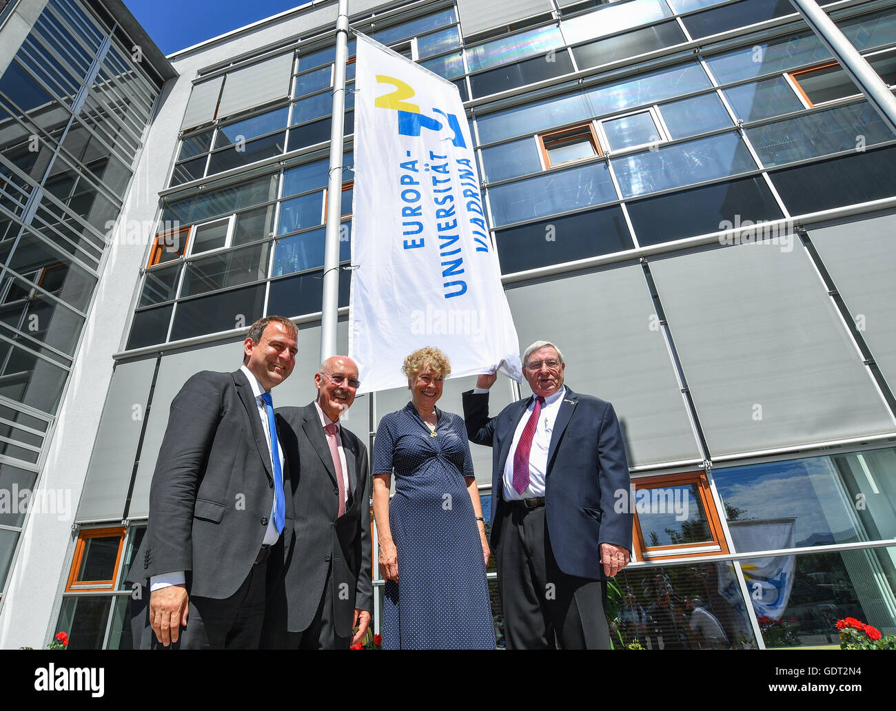 Alexander Woell (L), president of the Viadrina European University, poses with other former rectors and presidents of the university, Hans N. Weiler (R-L), Gesine Schwan and Gunter Pleuger after raising a flag with them to mark the 25th anniversary of the university in Frankfurt/Oder, Germany, 21 July 2016. A ceremonial act marking the 25th anniversary of the Viadrina European University was held on the same day. Photo: PATRICK PLEUL/dpa Stock Photo